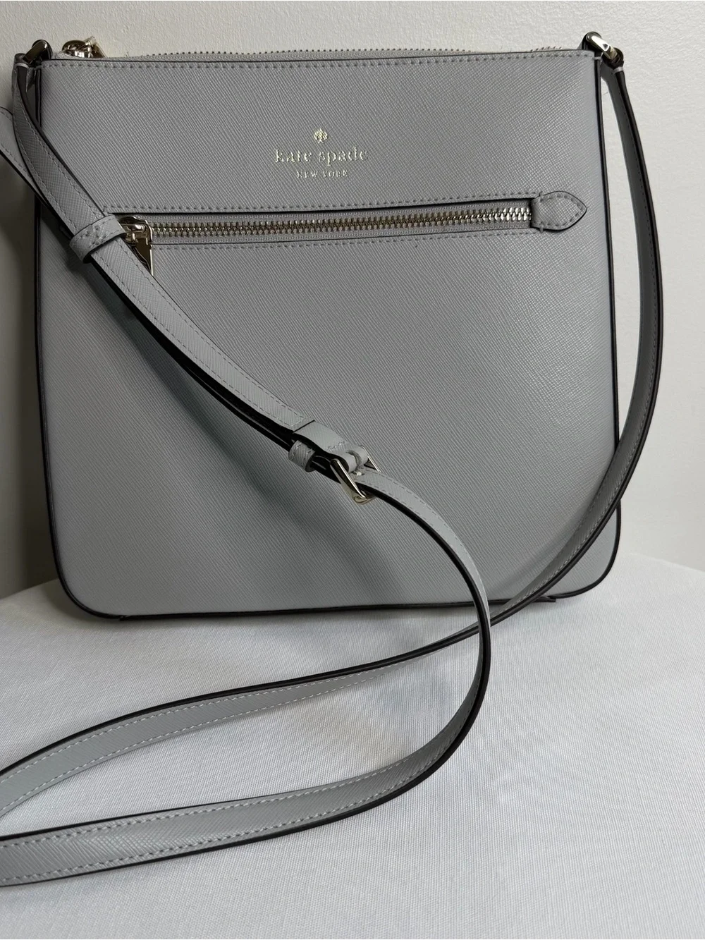 kate spade light gray saffiano leather messenger bag with gold hardware
